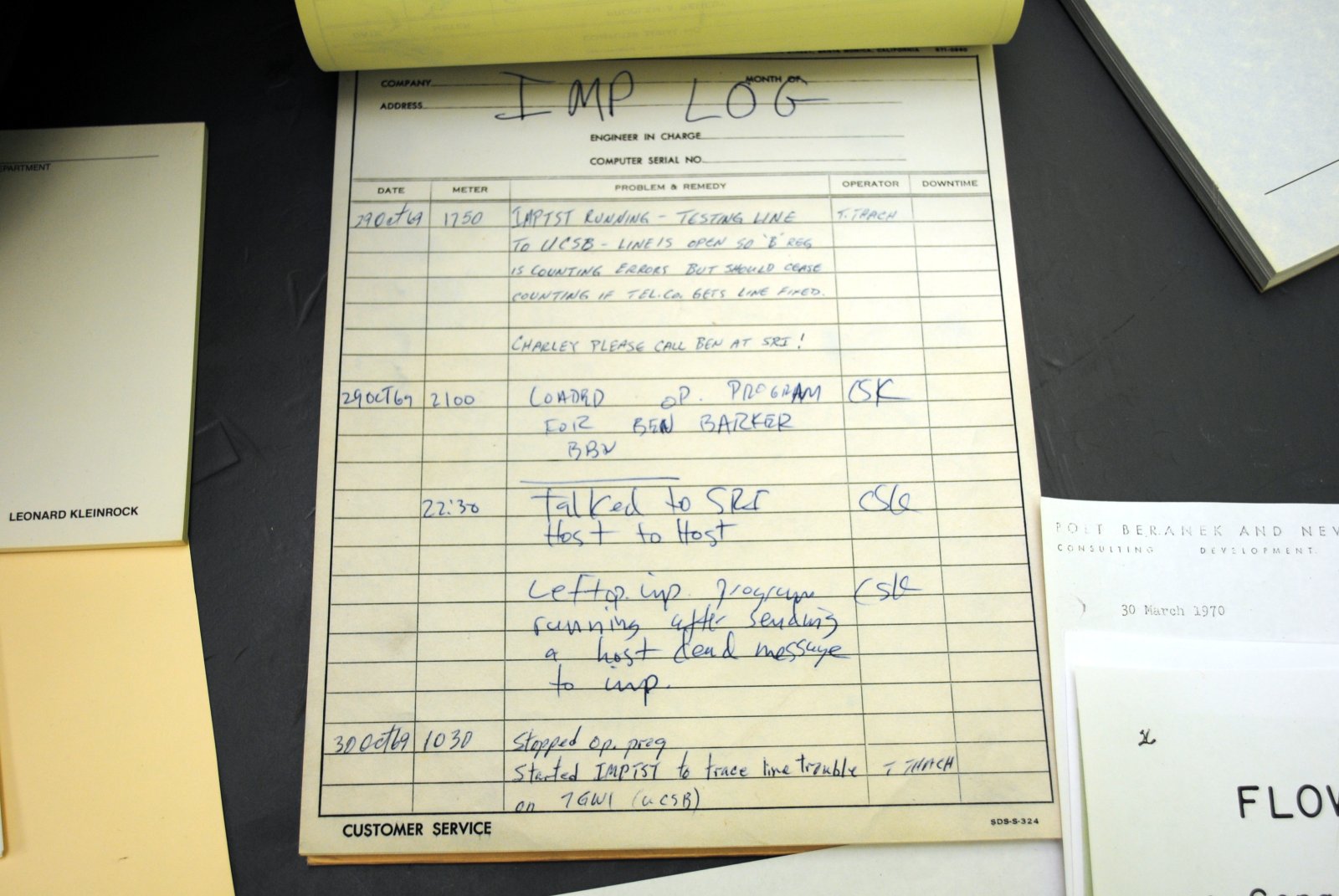 The handwritten UCLA IMP log sheet from October 1969, with the entry noting the first host-to-host connection to SRI