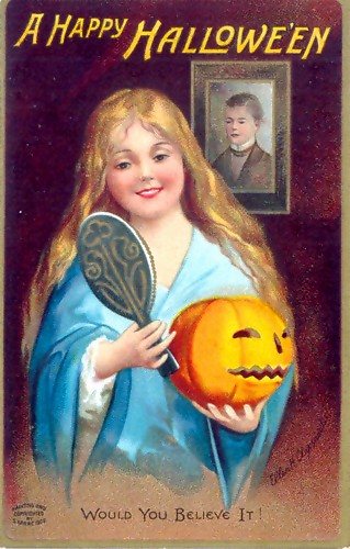 A 1904 Halloween postcard: a girl with long fair hair holds a hand mirror and a glowing jack-o'-lantern, with a boy's portrait on the wall behind her.